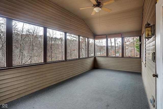 unfurnished sunroom featuring plenty of natural light, ceiling fan, lofted ceiling, and wood ceiling