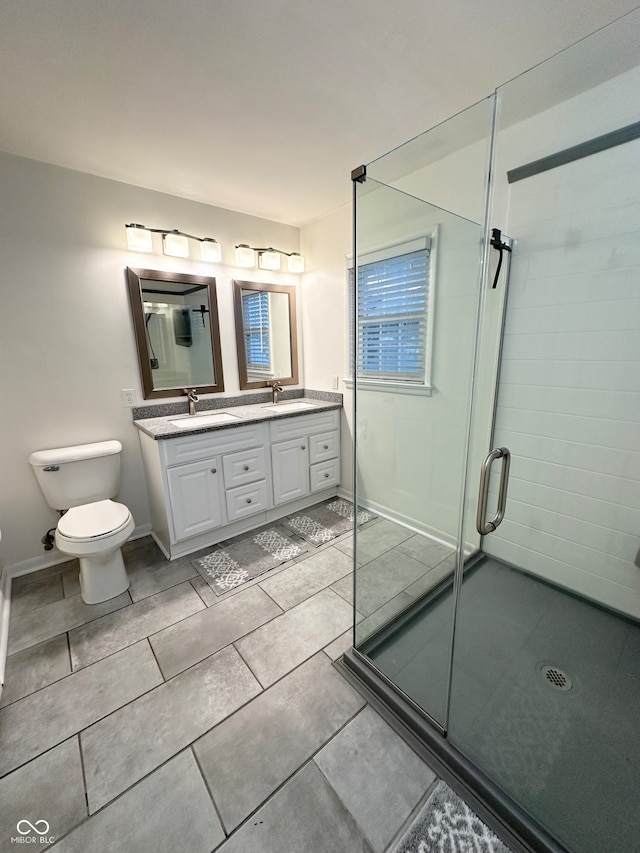 bathroom with vanity, toilet, and walk in shower