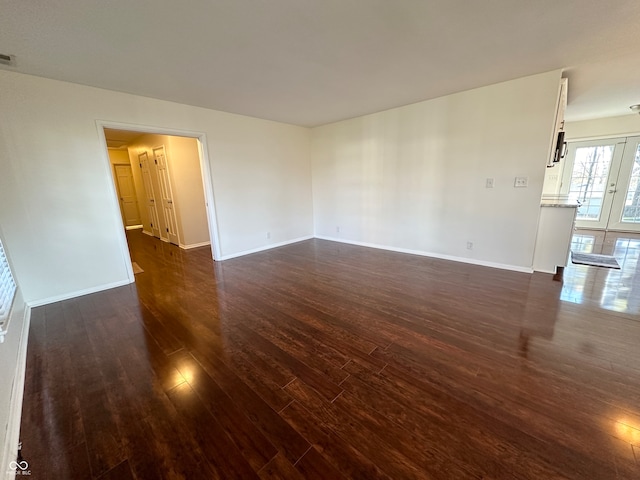 empty room featuring dark hardwood / wood-style flooring