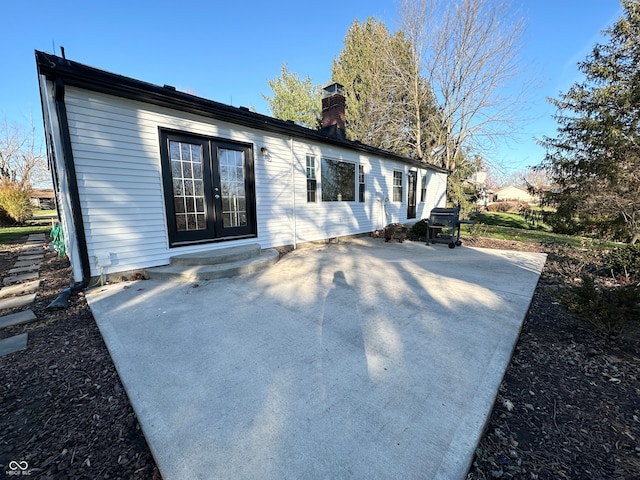 rear view of house featuring french doors and a patio