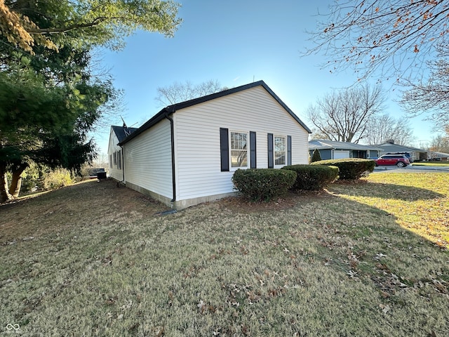 view of home's exterior featuring a yard