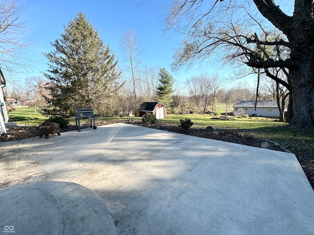 exterior space featuring a shed and a grill