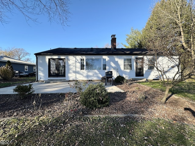 back of property featuring a patio