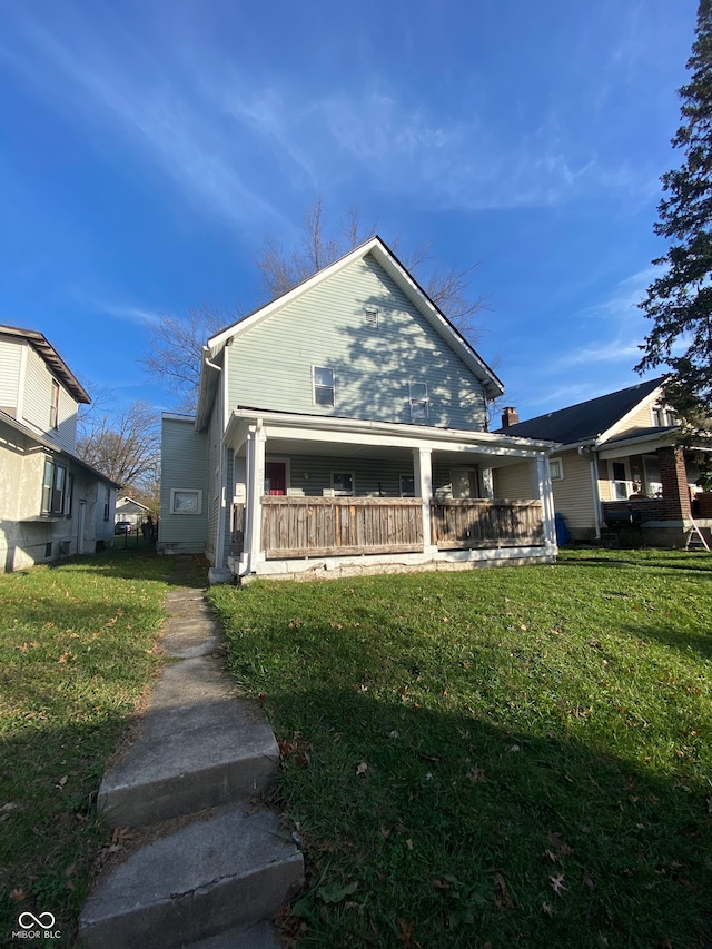 bungalow featuring a porch and a front lawn