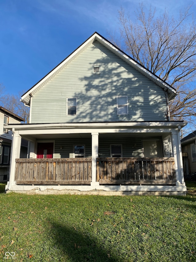 back of house with a yard