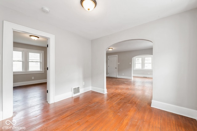 spare room featuring hardwood / wood-style floors