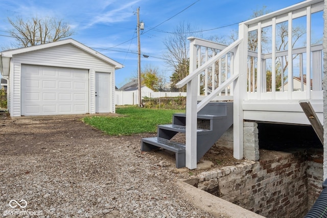 view of property exterior with an outbuilding and a garage