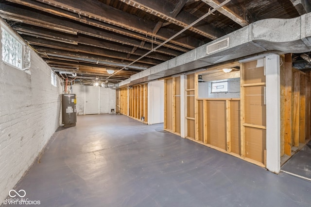 basement featuring electric water heater