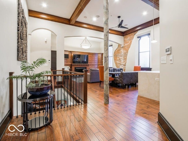 interior space with beam ceiling and wood-type flooring