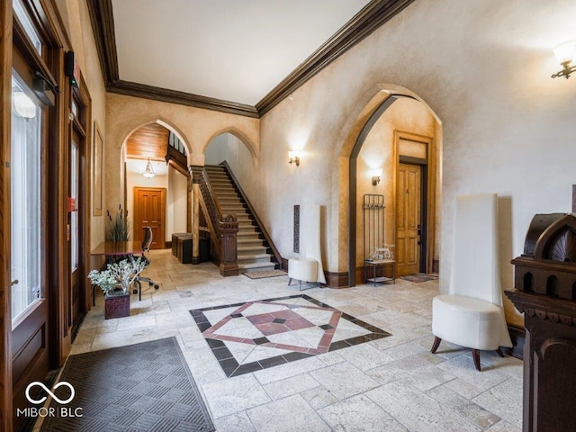 foyer featuring crown molding