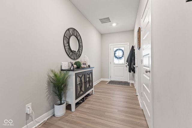 foyer entrance with light wood-type flooring