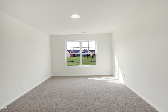 unfurnished room with carpet floors