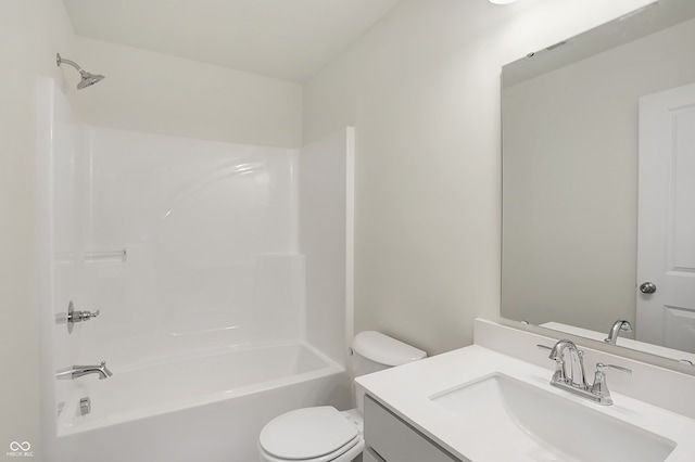 full bathroom featuring toilet, vanity, and washtub / shower combination