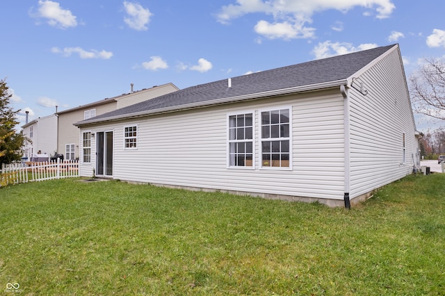 back of house with a yard