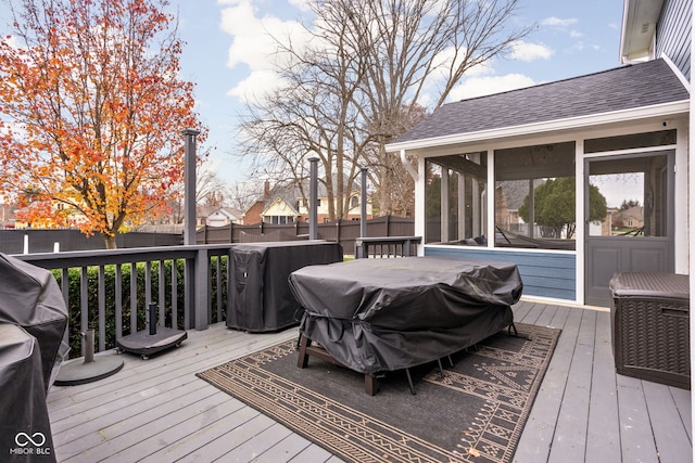 deck featuring a sunroom and grilling area