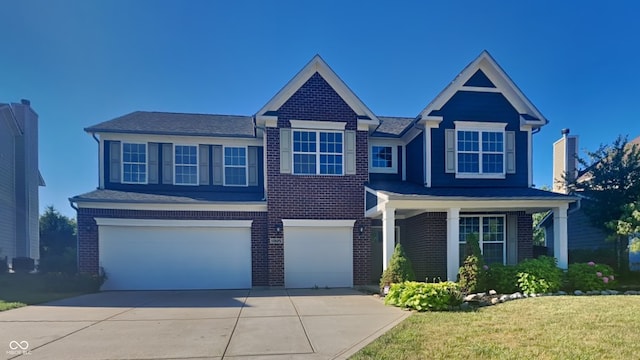 view of front facade featuring a garage and a front lawn