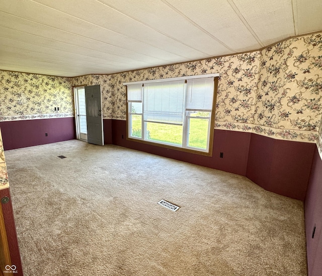 8418 S State Road 39, Clayton, IN 46118 - spare room with wallpapered walls, a wainscoted wall, and carpet flooring
