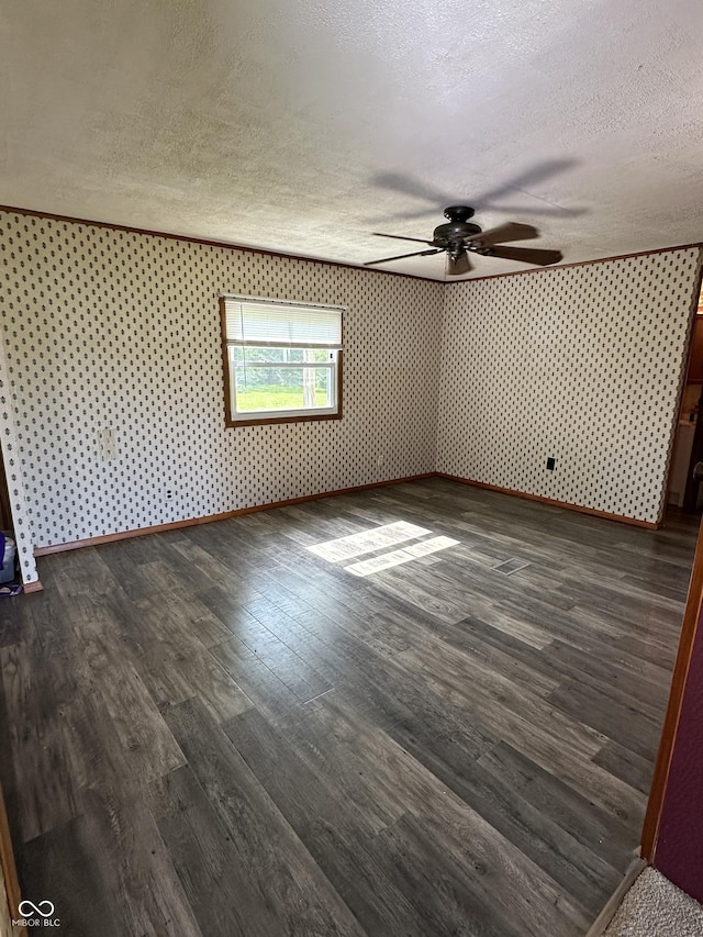 8418 S State Road 39, Clayton, IN 46118 - spare room with a textured ceiling, ceiling fan, and dark wood finished floors