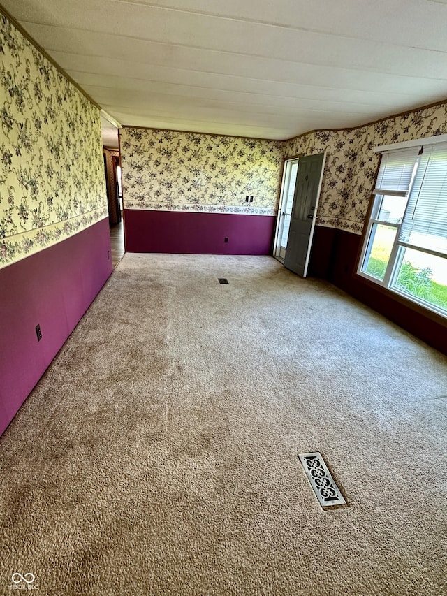 8418 S State Road 39, Clayton, IN 46118 - carpeted spare room featuring wallpapered walls and a wainscoted wall
