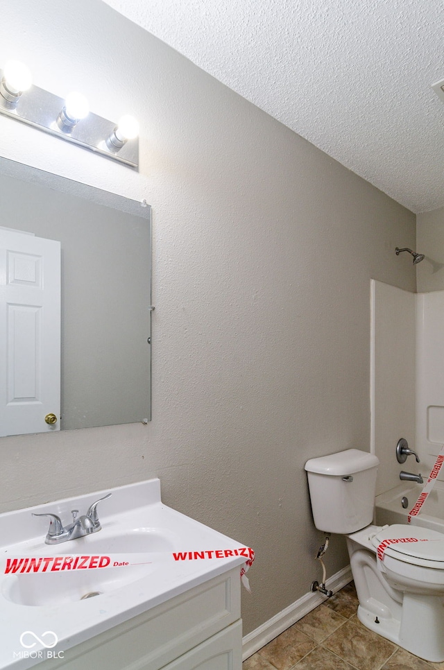 full bathroom featuring tile patterned floors, shower / bath combination, a textured ceiling, toilet, and vanity