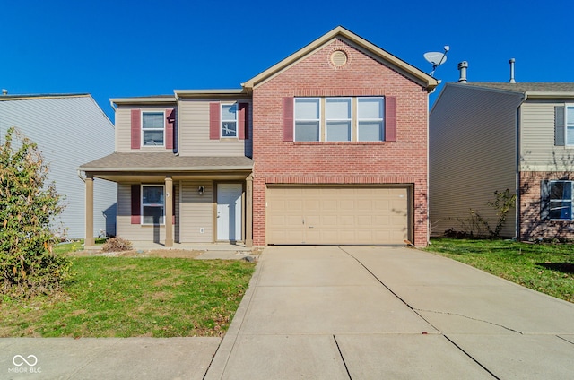 view of front of property featuring a front lawn and a garage