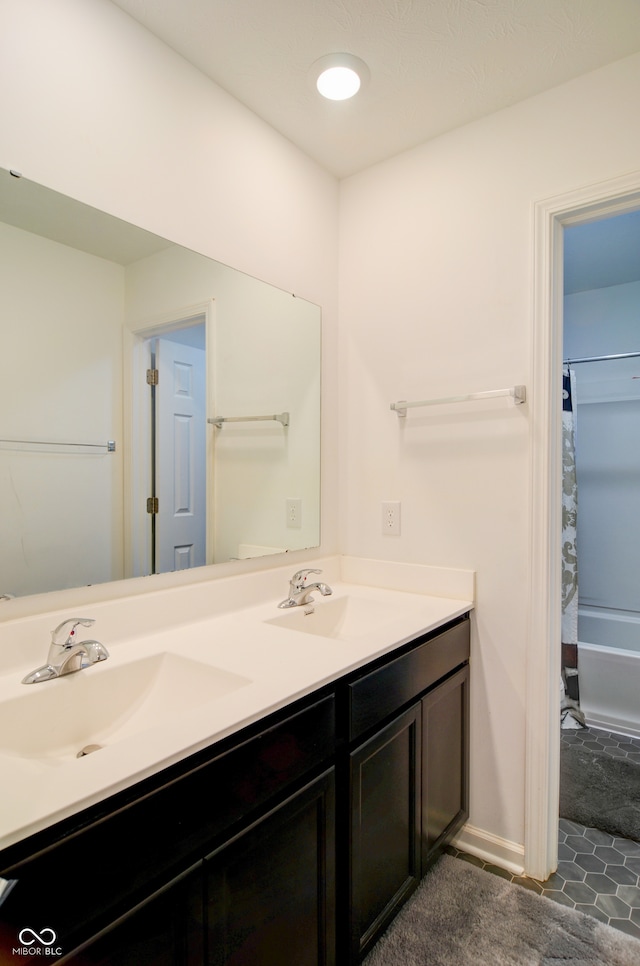 bathroom with vanity and shower / bathtub combination with curtain