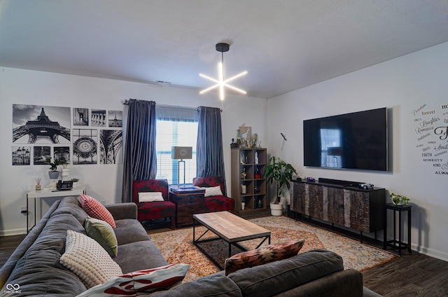 living room featuring a notable chandelier and hardwood / wood-style flooring