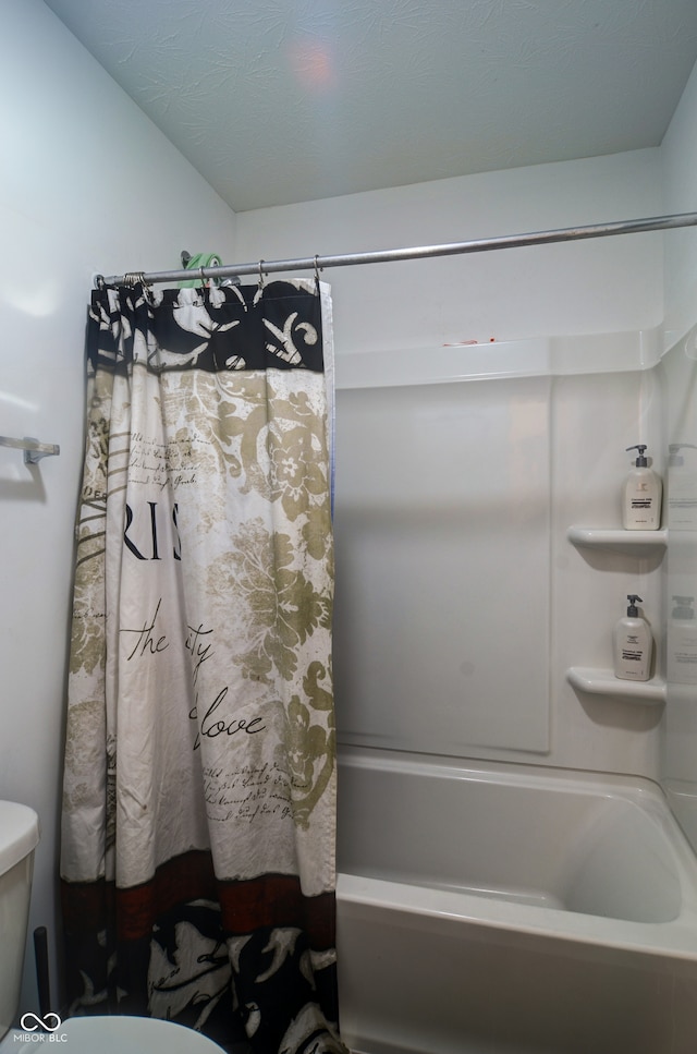 bathroom featuring toilet and shower / bathtub combination with curtain