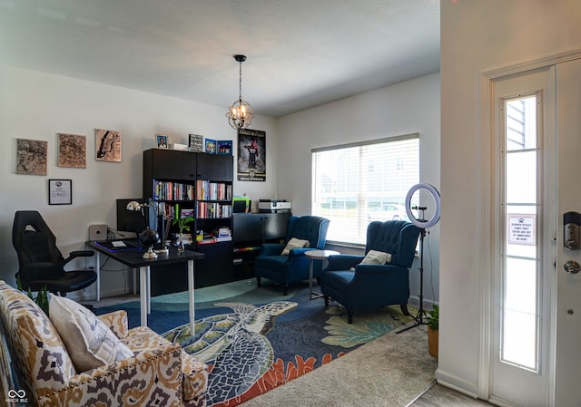 home office featuring hardwood / wood-style flooring and an inviting chandelier