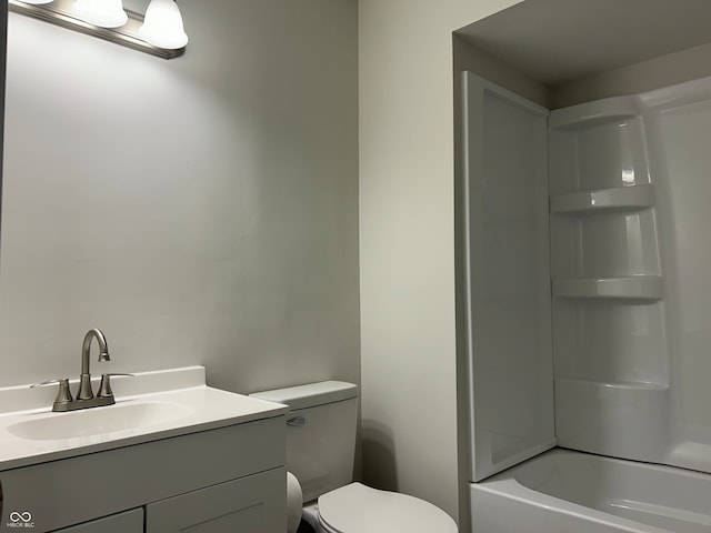 full bathroom with vanity, toilet, and  shower combination