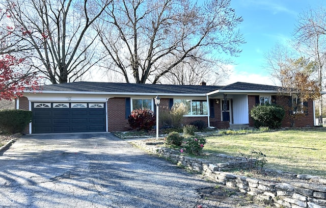 ranch-style house with a front lawn and a garage