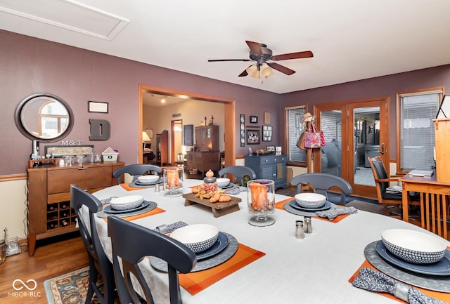 dining space featuring ceiling fan, a wealth of natural light, and hardwood / wood-style floors