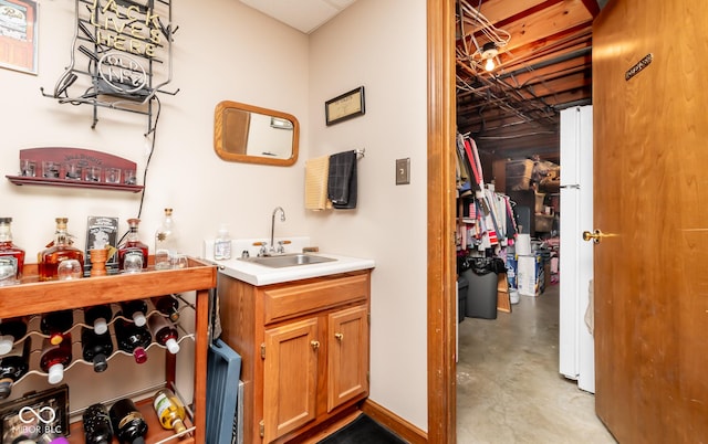 bathroom featuring concrete flooring and vanity