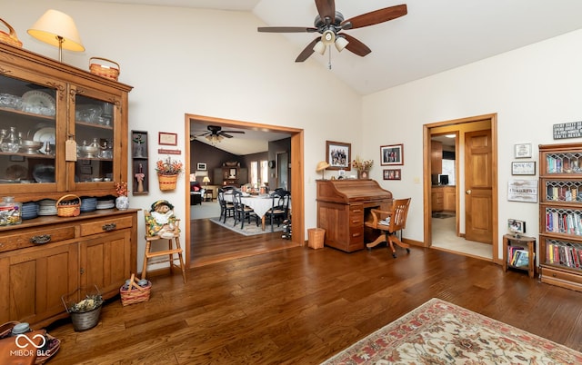 interior space featuring high vaulted ceiling, ceiling fan, and dark hardwood / wood-style floors