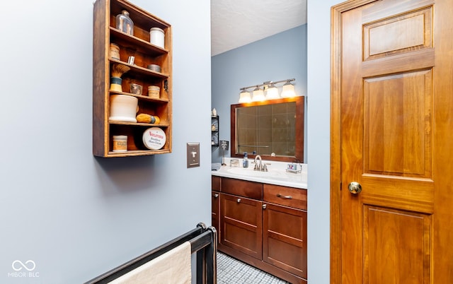 bathroom with tile patterned floors and vanity