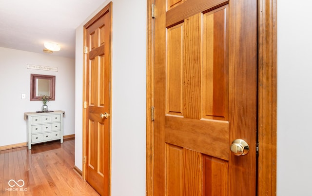 hall with light hardwood / wood-style flooring