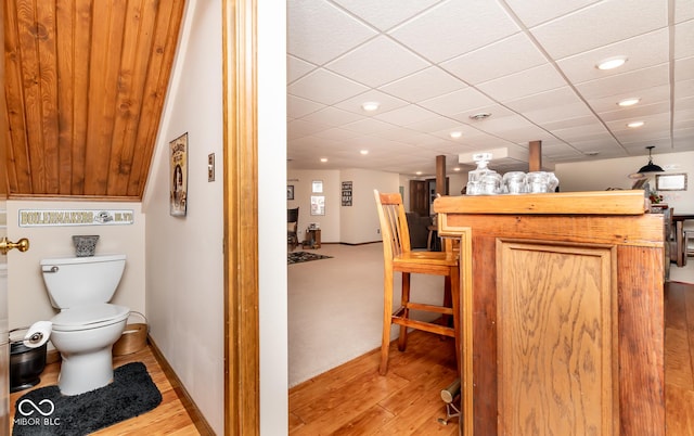 bathroom featuring toilet and hardwood / wood-style flooring