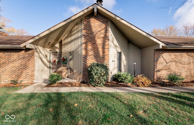 view of property exterior with a yard