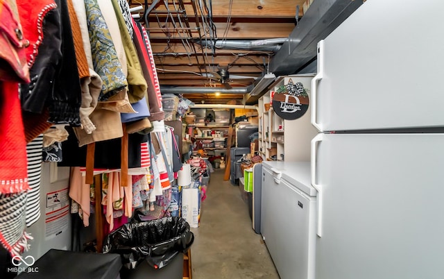 basement with white refrigerator