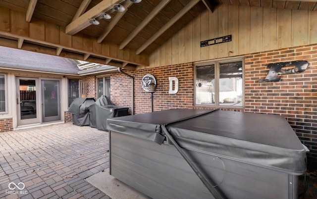 view of patio / terrace featuring a hot tub and area for grilling