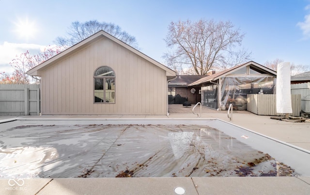 rear view of property featuring a patio