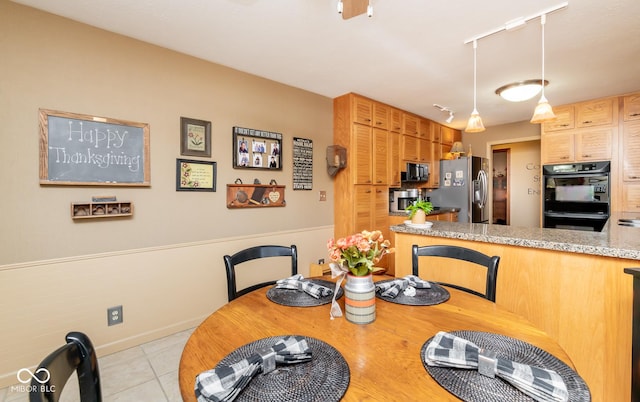 dining room featuring light tile patterned floors