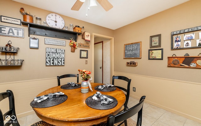 dining area with ceiling fan and light tile patterned floors