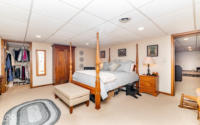 bedroom featuring a closet and light carpet