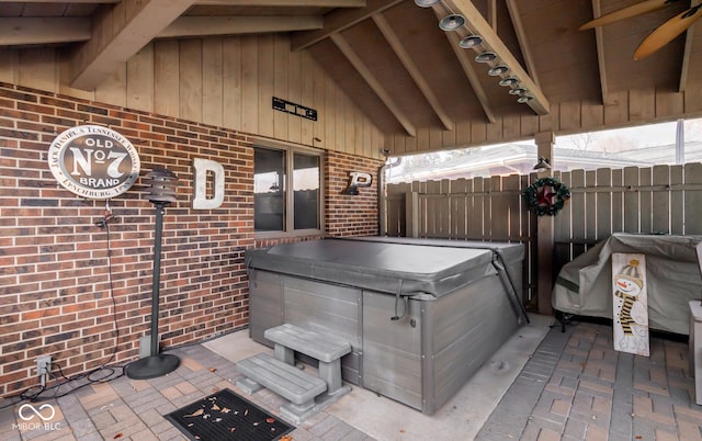 view of patio / terrace with a hot tub