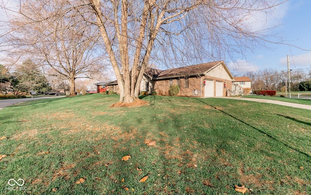 single story home with a front lawn and a garage