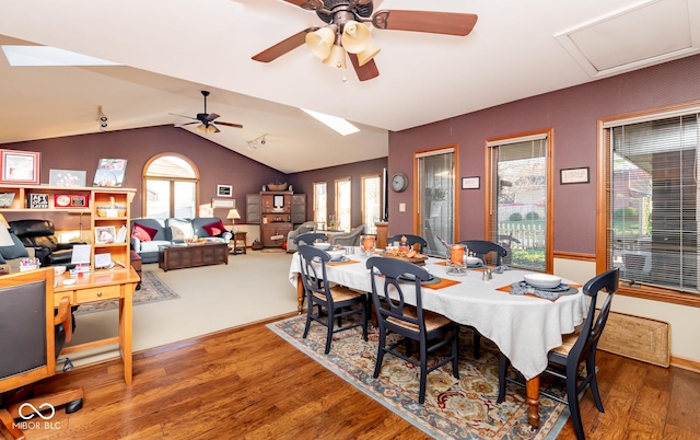 dining room featuring lofted ceiling, ceiling fan, and hardwood / wood-style floors