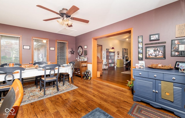 dining room with ceiling fan and wood-type flooring