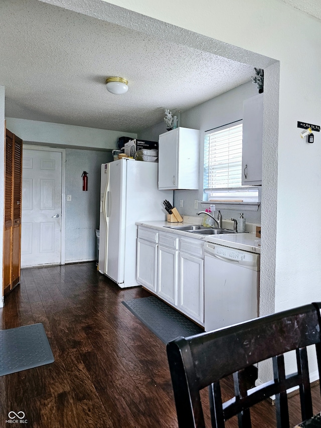 kitchen featuring white cabinetry, sink, and dark hardwood / wood-style floors