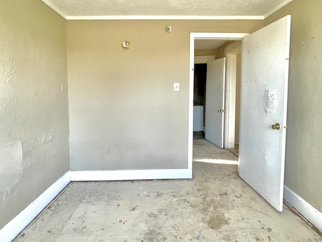 spare room featuring crown molding